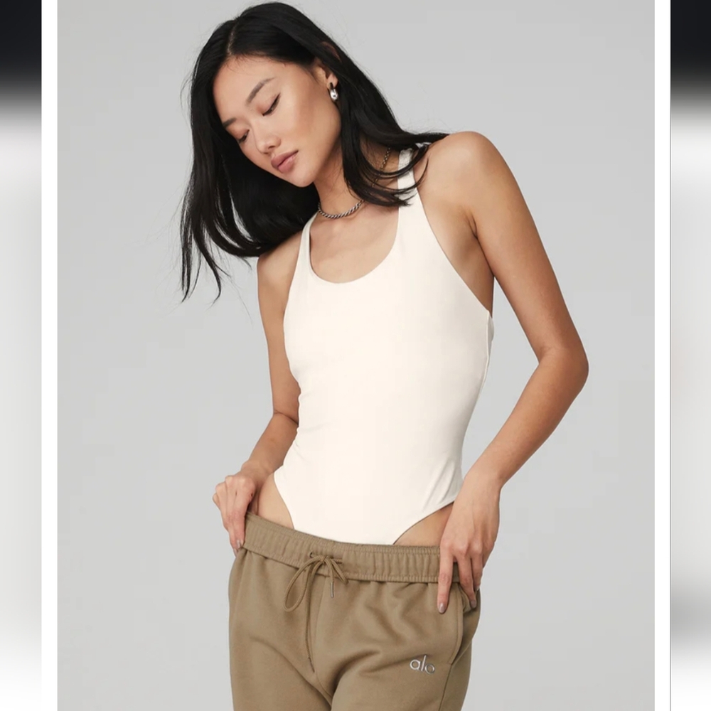 2 pack Alo Yoga Sleek back bodysuit in white and ivory